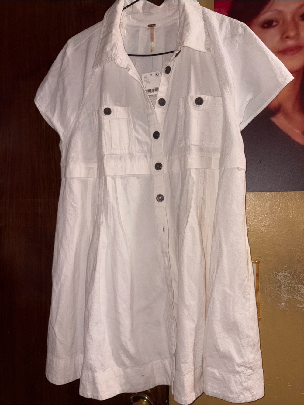 Free People Flowy short  dress with side pockets. Color is like eggshell